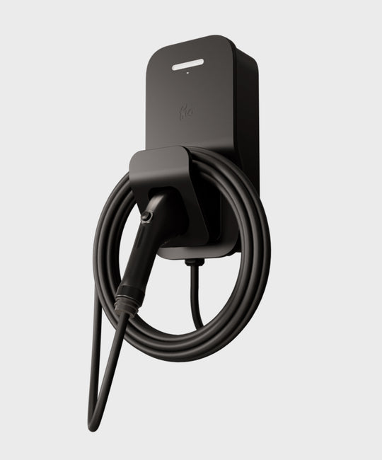 FLO Home X3 Black home EV charger with J1772 connector, side view, connector in holster, white background